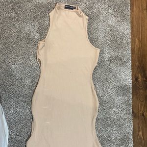 I'm selling a tan short dress with designs on the side